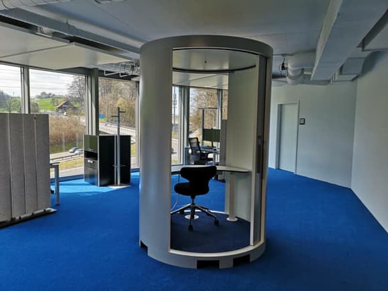 modern office, blue carpet, round chair, glass windows, computer desk, modern office equipment