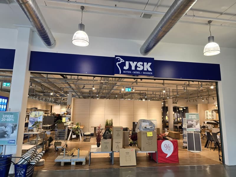 JYSK furniture store with entrance, interior displays, boxes, and sale signs