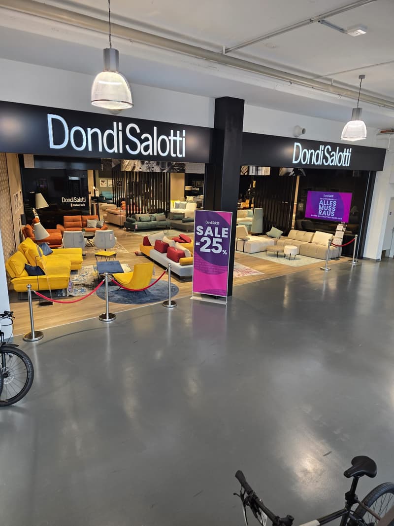 Exterior of Dondi Salotti store, furniture on display, entrance, promotional sale sign
