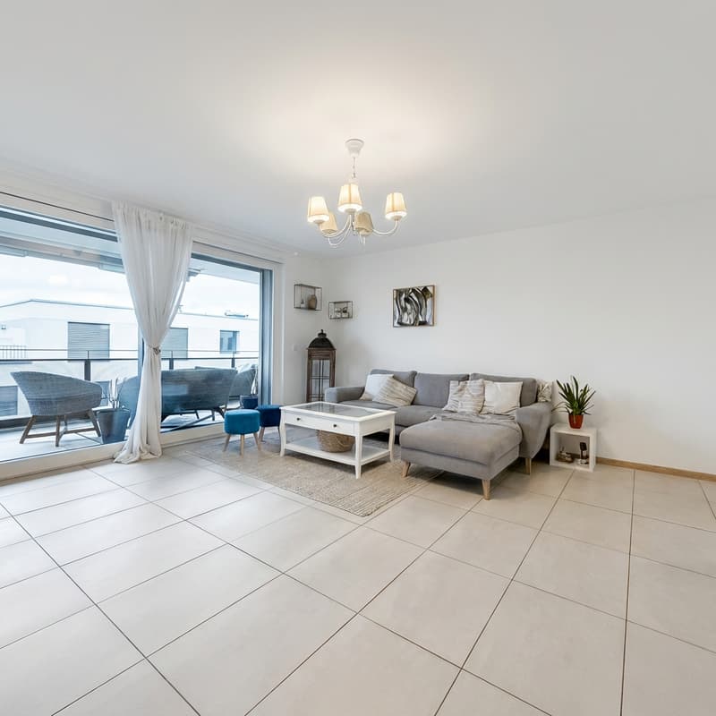 large glass door, balcony, white tile flooring, gray couch, white coffee table, chandelier