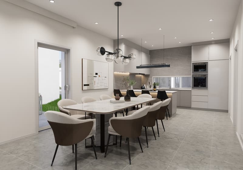 The image shows a modern and spacious kitchen and dining area. The kitchen features sleek gray cabinets, a built-in oven, and a dishwasher. The dining table is large and rectangular, with comfortable upholstered chairs surrounding it. The room has a minim