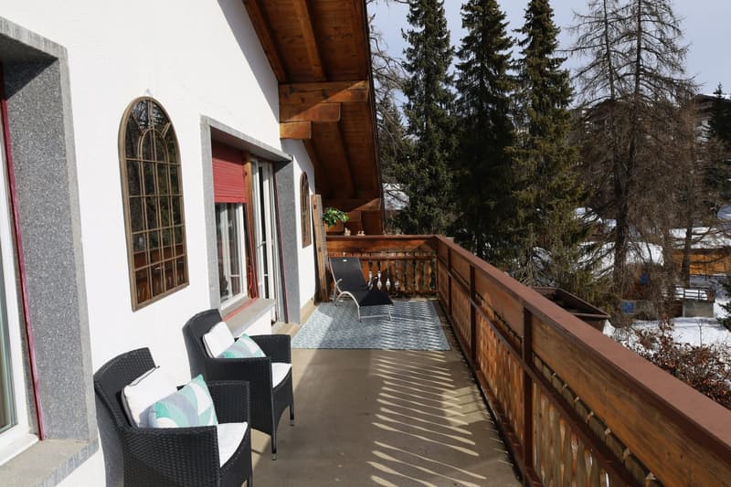 House exterior with balcony and view of snow-covered landscape