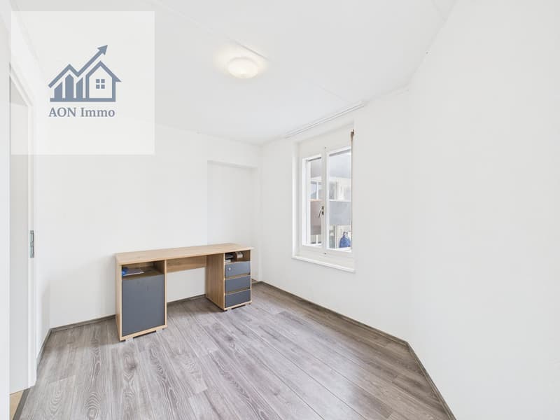 empty room, wooden desk, drawers, window, white walls, wooden floor