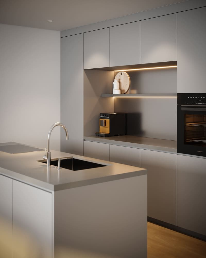 Modern kitchen with large island, sink, faucet, black oven, built-in appliances, open shelves, grey cabinets, and tiled floor.