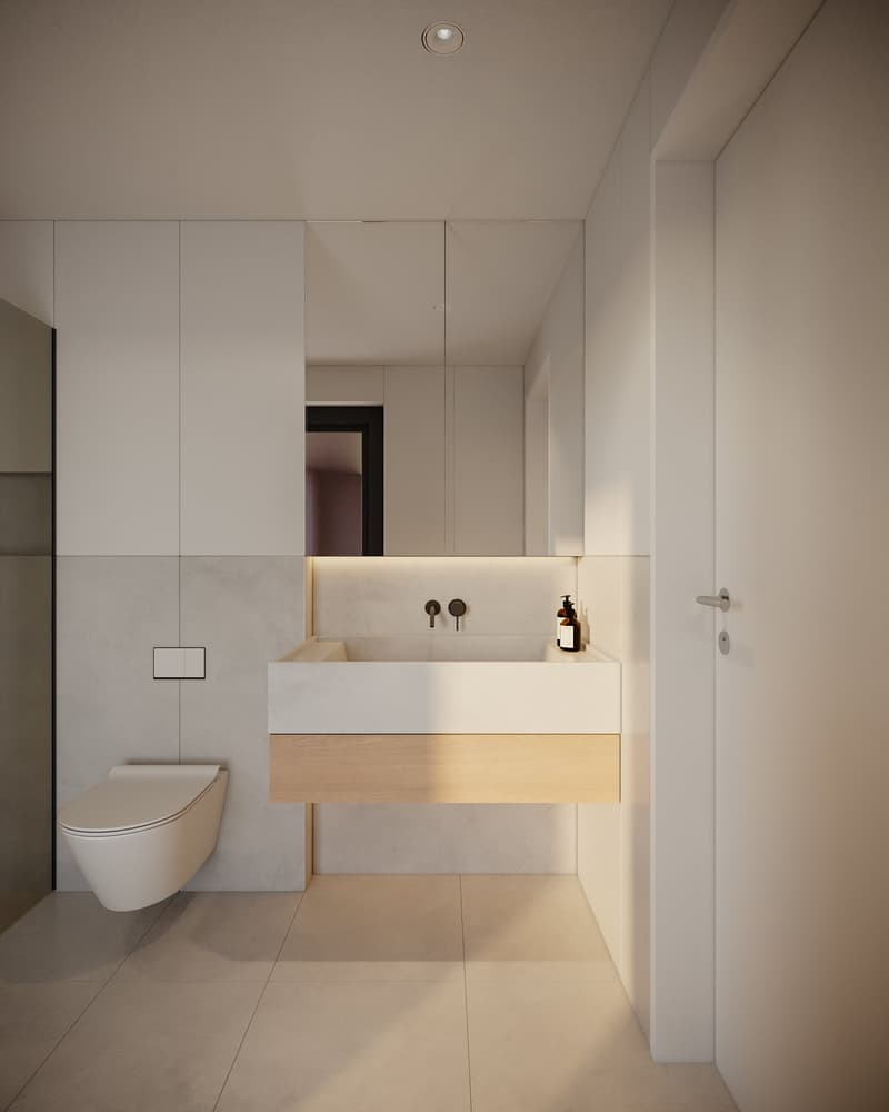 Bathroom with a sink, mirror, and toilet, with tiled walls and floors.
