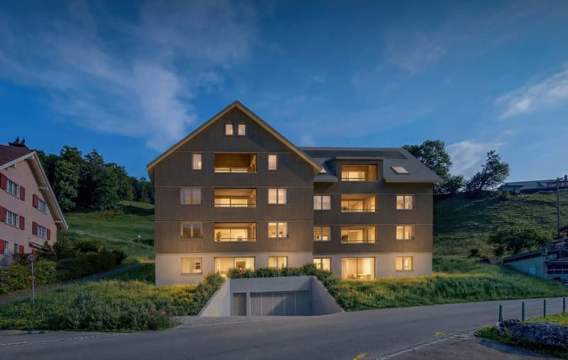 Modern apartment building with 4 floors, underground garage, surrounded by greenery
