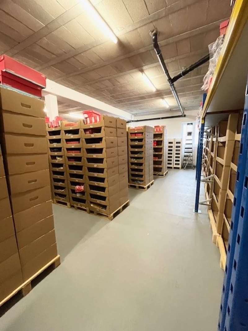 industrial warehouse with rows of boxes and shelves