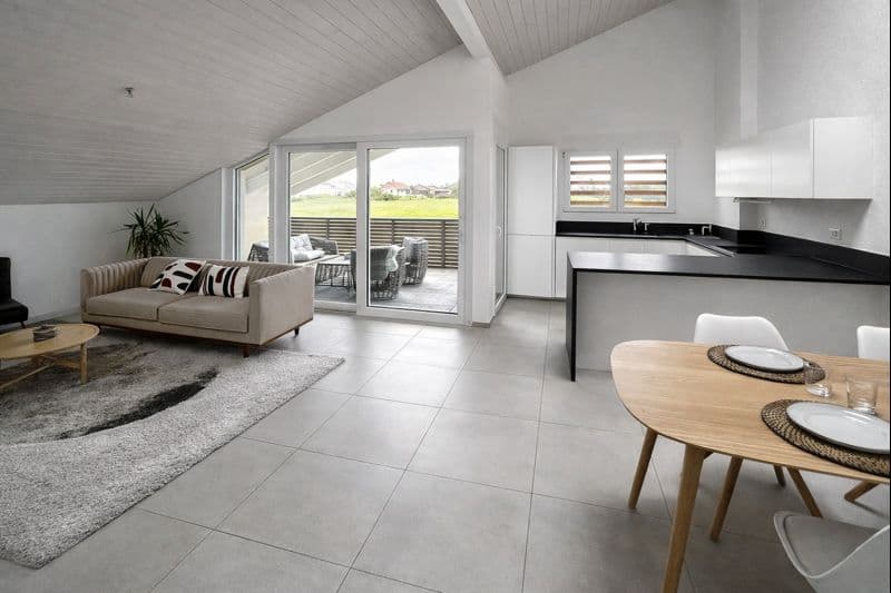 modern apartment with large windows, glass sliding door, balcony, dining table, kitchen island, sofa
