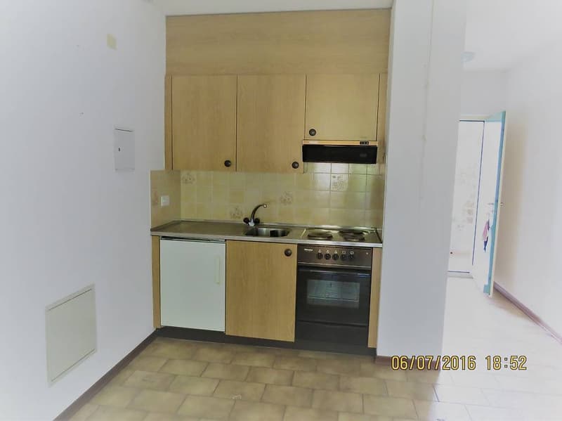open kitchen with appliances and tiled floor