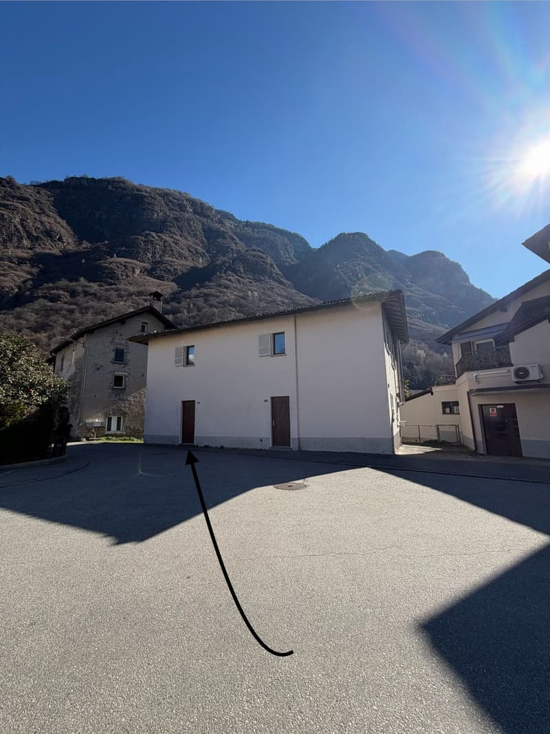 A house with mountains in the background