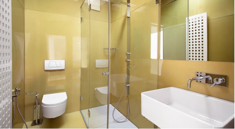 modern bathroom, glass walls, white toilet, shower area, white sink, minimalist design