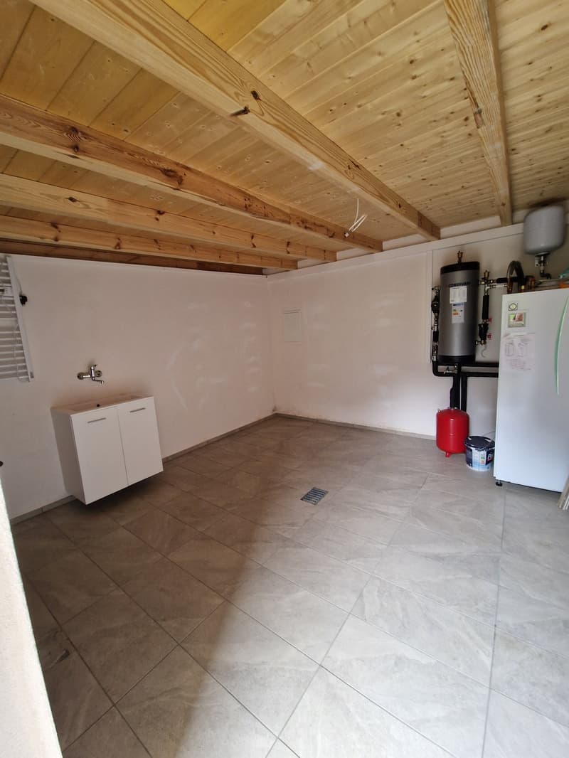 empty room, tiled floor, wooden ceiling, white cabinet, sink, water heater, refrigerator