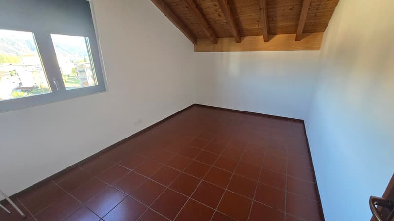 empty room, brown tiles, wooden ceiling, window with view