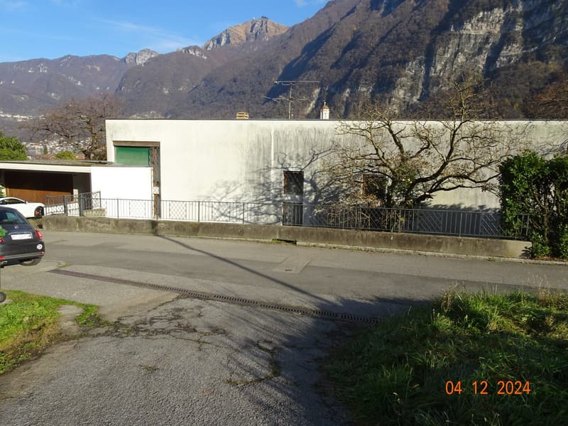 white house, garage, fenced yard, trees, mountains