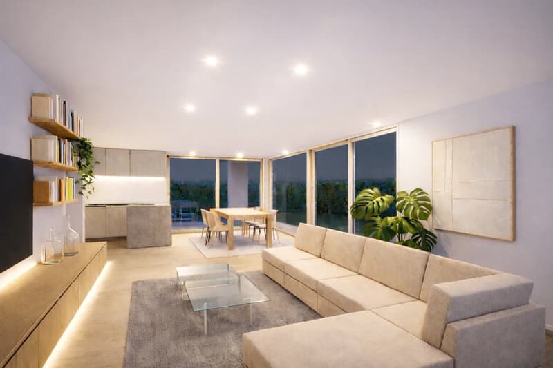 Modern living room with beige sofa, glass coffee table, large windows, balcony with dining table