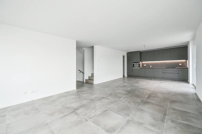 empty room, tiled floor, white walls, gray cabinets, kitchen appliances, staircase