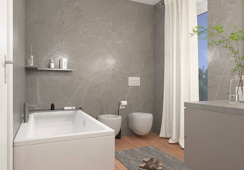 Modern bathroom with large bathtub, shower, and separate toilet