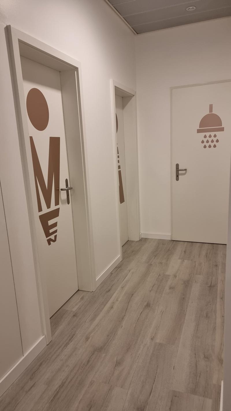empty room with 2 doors and wooden floor