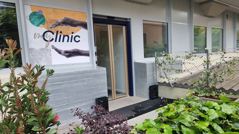 myClinic sign, entrance door, glass panel, grey exterior, plants