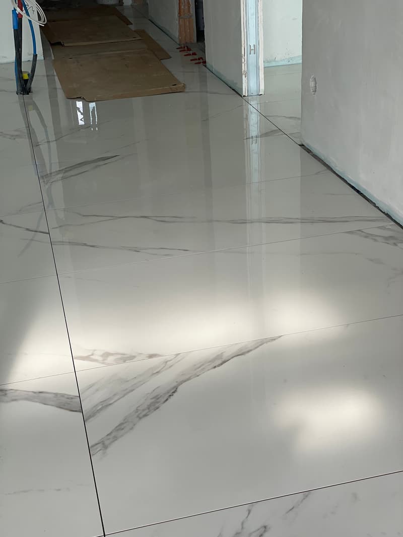 white marble flooring, white walls, open space