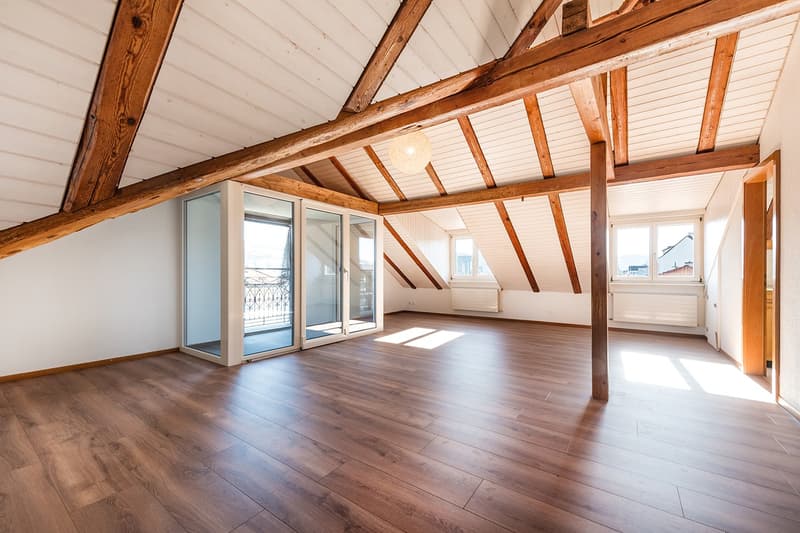 exposed wooden beams, double-glazed windows, wooden floor, balcony, chandelier