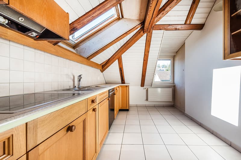 kitchen with wooden cabinets and tiled flooring