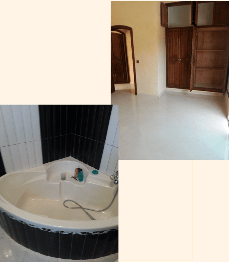 A corner bathtub, tiled walls, tiled floor, shower, shower hose