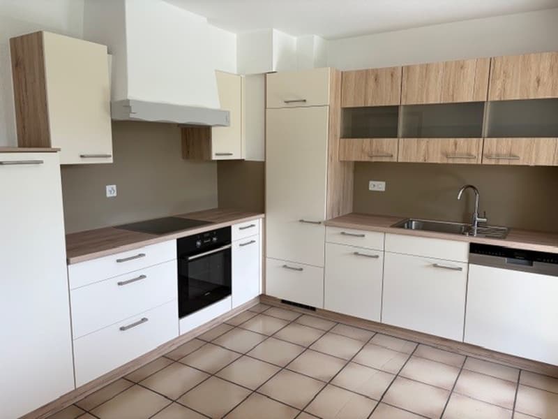 modern kitchen with white cabinets, wooden countertops, tiled floor, black stove, oven, sink, faucet, dishwasher, power outlets
