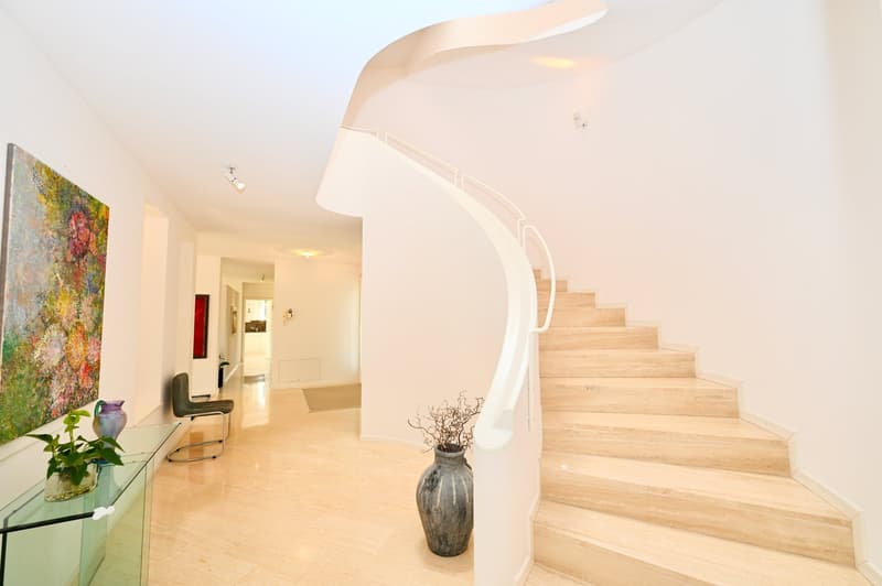 spiral staircase, wooden floor, modern decor, painting, vase, chair, glass table