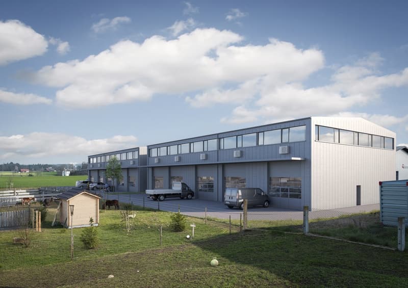 Large industrial building, multiple windows, 2 vans parked, fenced area, cars parked, grassy area, fencing