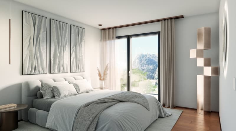 Modern styled bedroom with bed, pillows, books on table, large white windows, and mountain view.