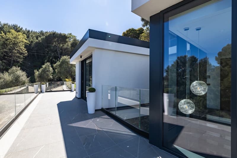 modern house, white exterior, glass railing, glass door, glass windows, tiled floor, potted plants