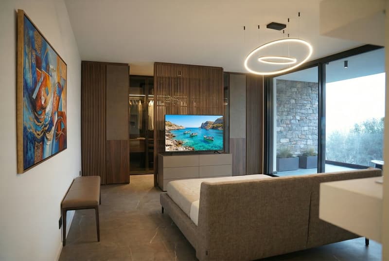 modern living room with a large sofa, a TV, a wooden bench, a painting, and a glass door leading to a balcony