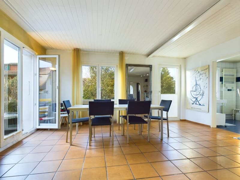 dining table with 6 chairs, white walls, windows, yellow curtains, light ceiling, beige tile floor