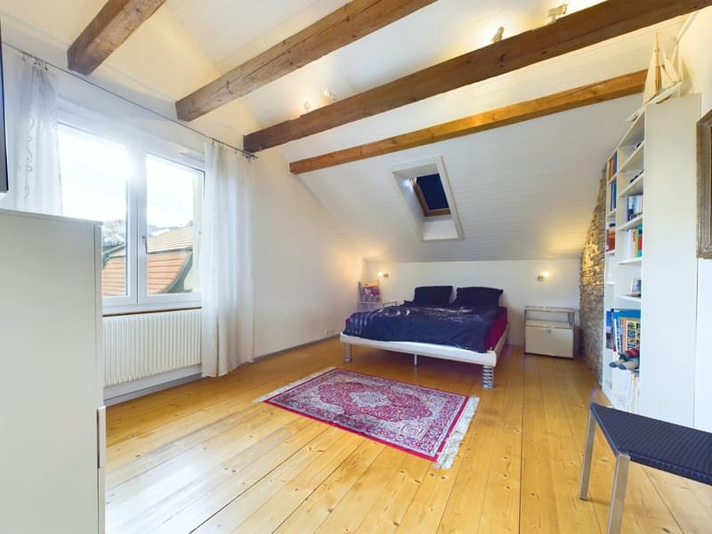 bedroom with a bed, carpet, radiator, wooden ceiling, window with curtain, and storage space