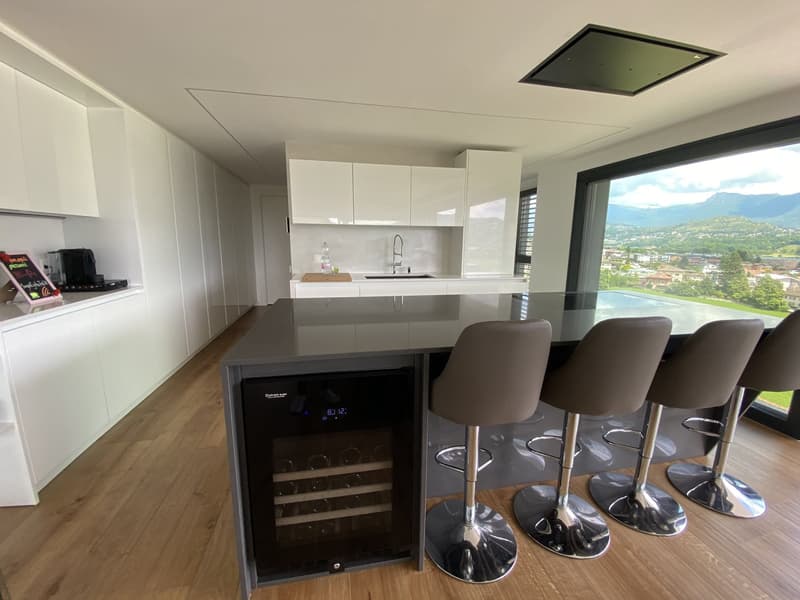 modern kitchen with island, wine cooler, 4 bar stools, large windows, wooden floor