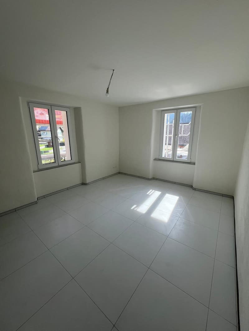 empty room, white tiles, two windows, white walls, ceiling light