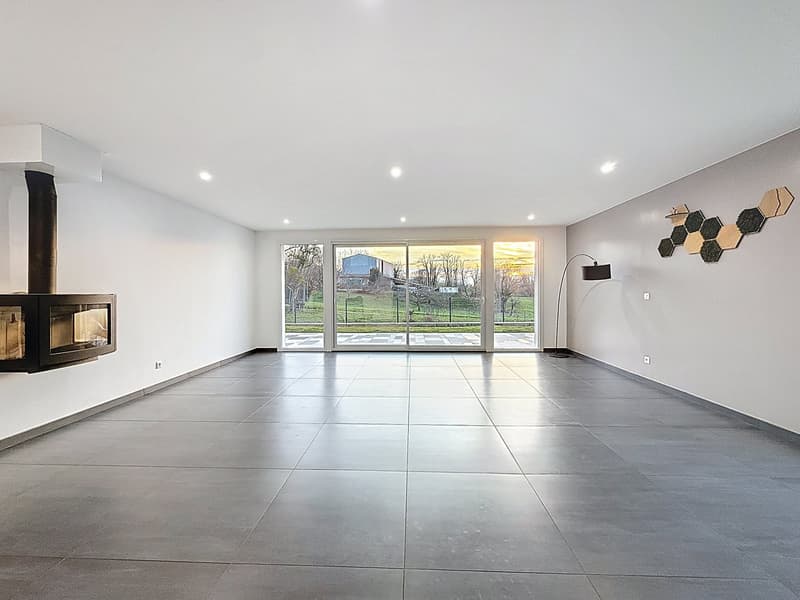 empty room, fireplace, sliding glass doors, tiled floor, white walls, ceiling lights