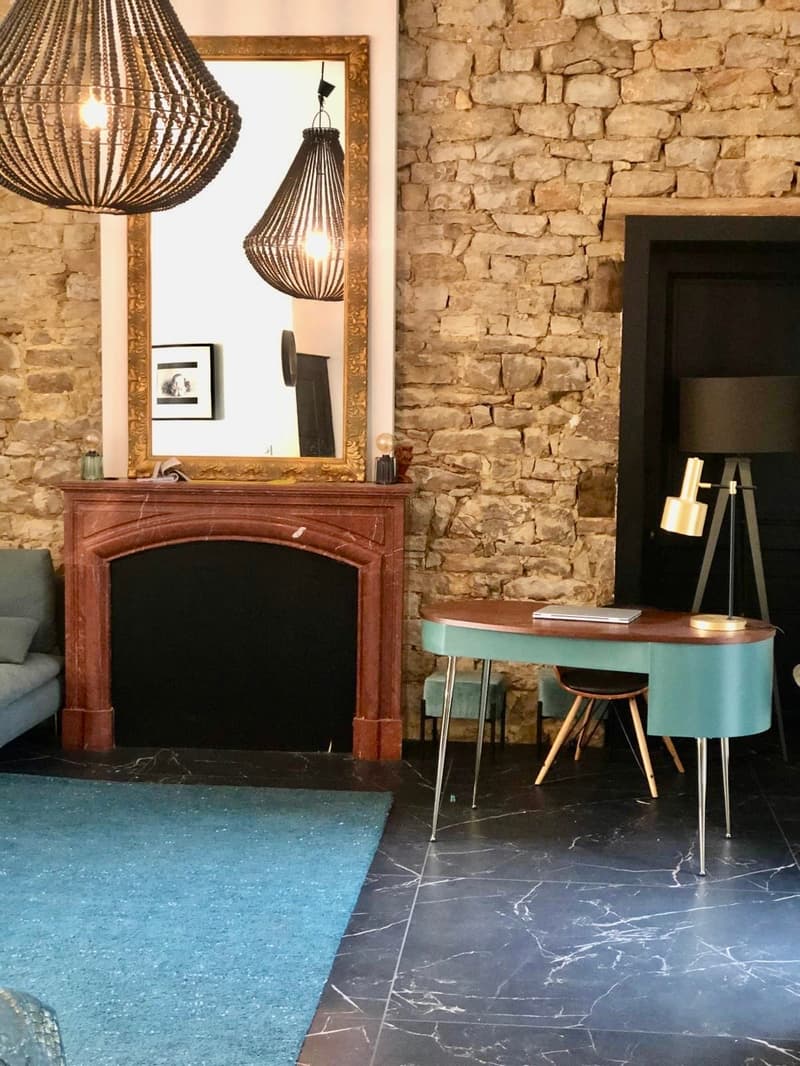 Fireplace, mirror, desk, lamp, rug, couch