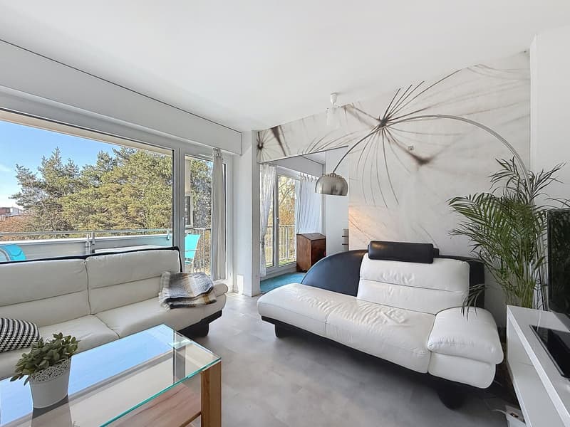 white leather sofas, glass coffee table, floor lamp, balcony, large windows, plants