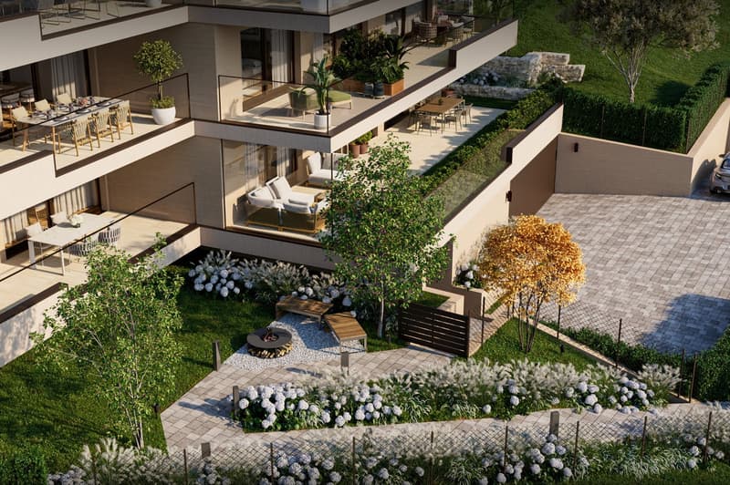 Exterior view of a building with multiple terraces, garden with fire pit and trees, grass, and a paved driveway