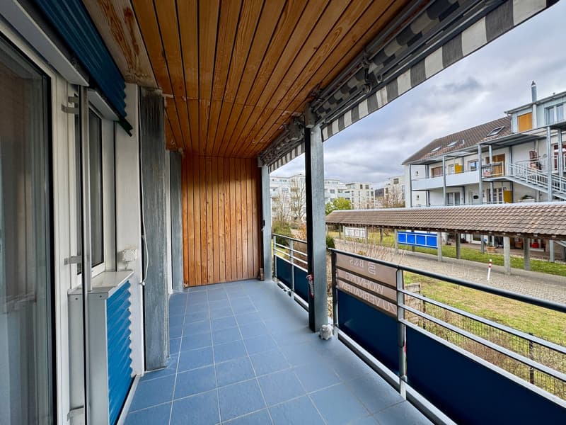 blue tiled floor, wooden ceiling, metal railings, outdoor view