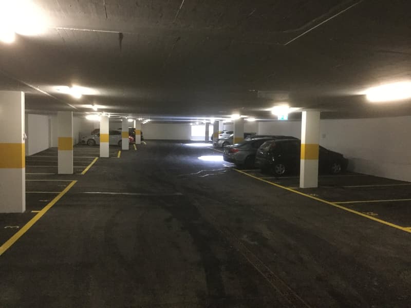 underground parking garage with 6 parking spaces in a row