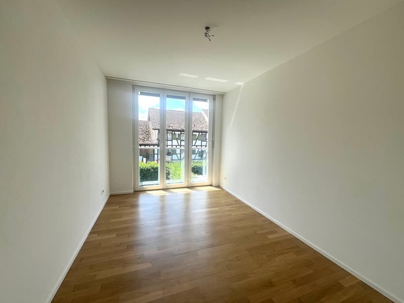 empty room, wooden floor, white walls, sliding glass doors, balcony