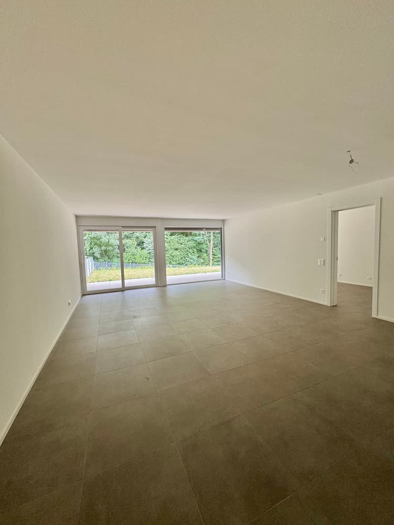empty room, white walls, tiled floor, sliding glass doors, balcony
