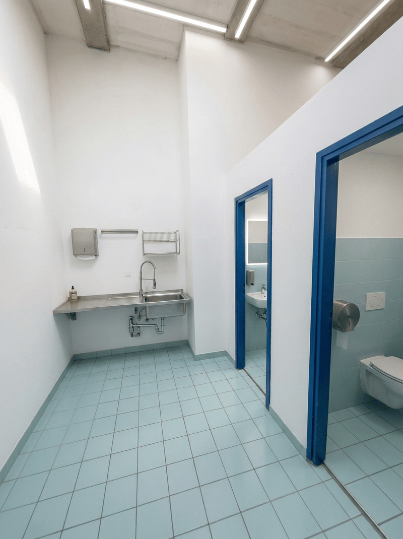 Bathroom with sink, toilet, and mirror
