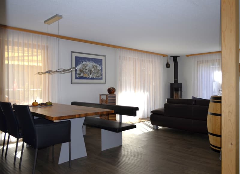 wooden table, black chairs, black bench, fireplace, picture, couch