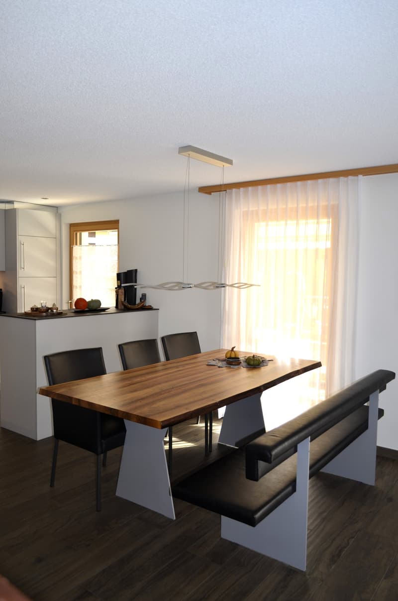 wooden table, black chairs, bench, pendant light, kitchen counter, glass windows, wooden floor