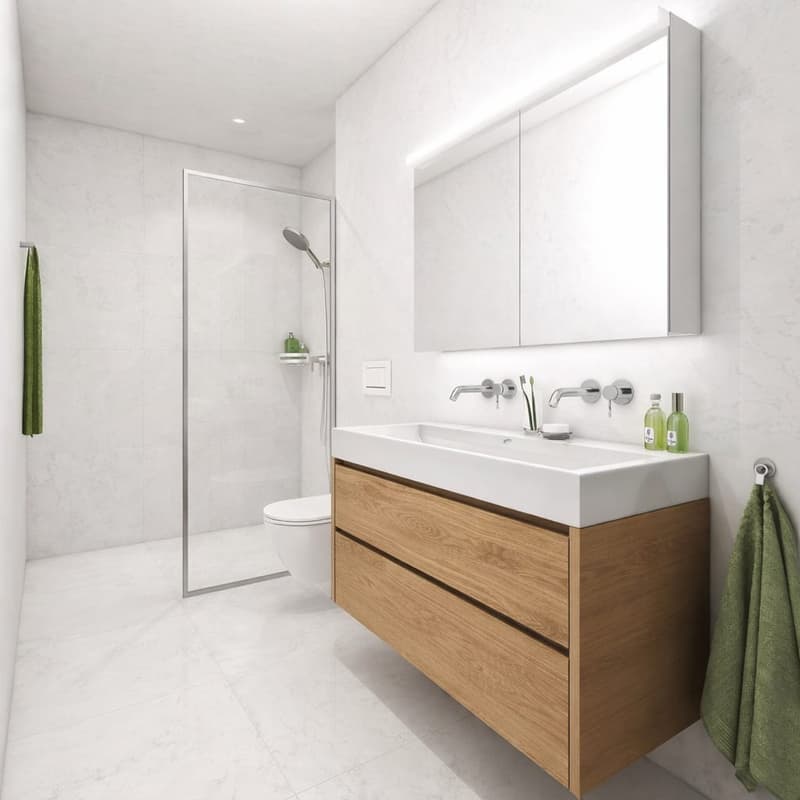 modern bathroom with white tiles, wooden vanity, double sink, glass shower enclosure, toilet, green towels