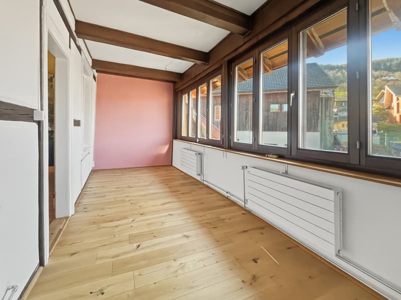wooden floor, tall windows, pink wall, wooden window frames
